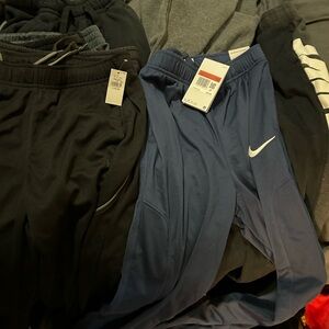 7 pair Joggers boys large, nike, under armour, other brand